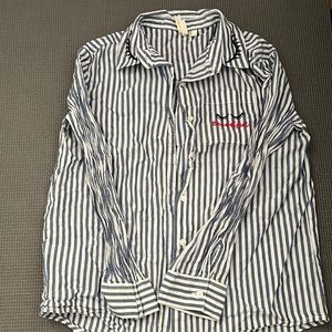 Blue and white striped button up with a few sewn in designs.